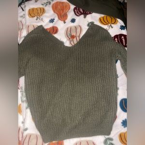 Green sweater with open back